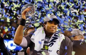 Rangers infielder Russell Wilson shown holding Lombardi Trophy