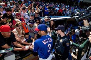 Russell Wilson signing autographs at Rangers camp today.